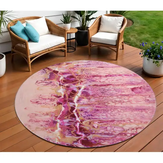8' Raspberry Ivory And Gold Round Abstract Washable Indoor Outdoor Area Rug Photo 1