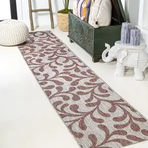 Photo of 10' Red And Beige Floral Indoor Outdoor Runner Rug