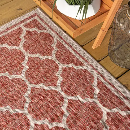 8' Red And Beige Round Geometric Indoor Outdoor Area Rug Photo 6