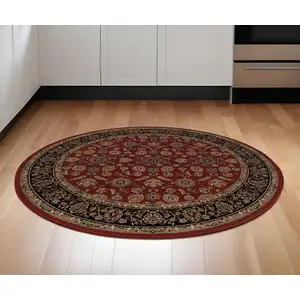 Photo of 6' Red And Black Oriental Round Rug