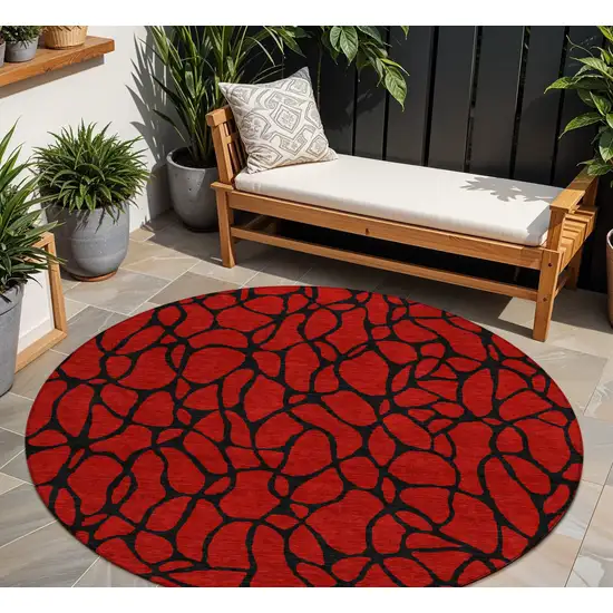 8' Red And Black Round Geometric Washable Indoor Outdoor Area Rug Photo 1