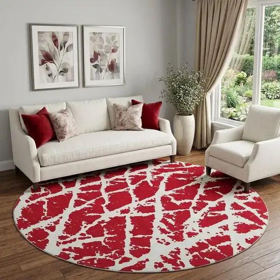 8' Red And Ivory Abstract Washable Round Rug With UV Protection Photo 1