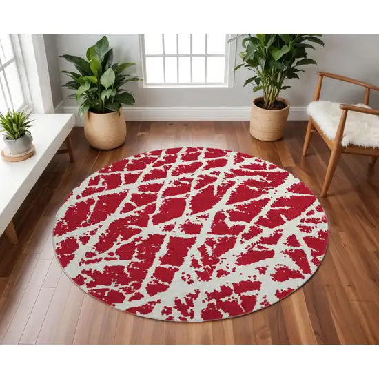 8' Red And Ivory Abstract Washable Round Rug With UV Protection Photo 2