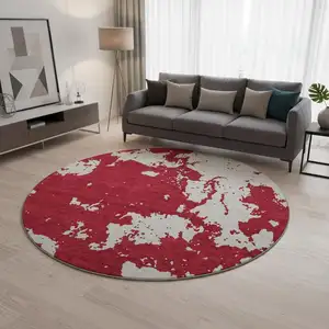 Photo of 8' Red And Ivory Abstract Washable Round Rug With UV Protection