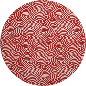 Photo of 8' Red And Ivory Abstract Washable Round Rug With UV Protection