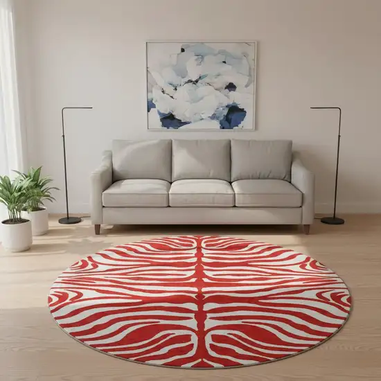 8' Red And Ivory Animal Print Washable Round Rug With UV Protection Photo 2