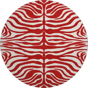 Photo of 8' Red And Ivory Animal Print Washable Round Rug With UV Protection