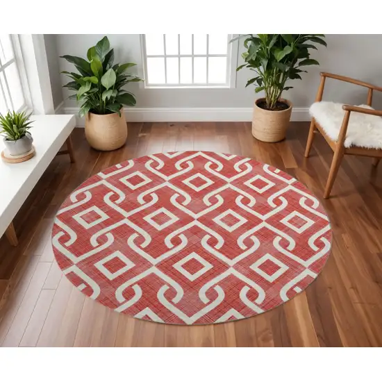 8' Red And Ivory Geometric Washable Round Rug With UV Protection Photo 2