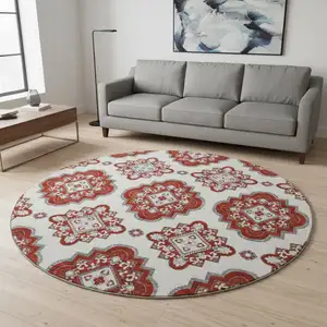 Photo of 8' Red And Ivory Medallion Washable Round Rug With UV Protection