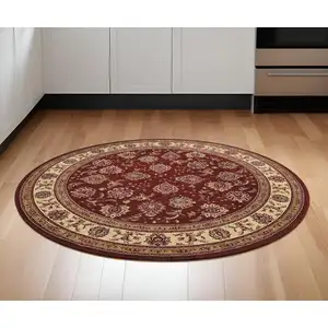 Photo of 6' Red And Ivory Oriental Round Rug