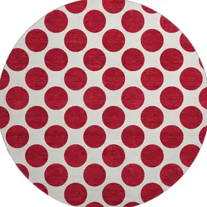 Photo of 8' Red And Ivory Polka Dot Washable Round Rug With UV Protection