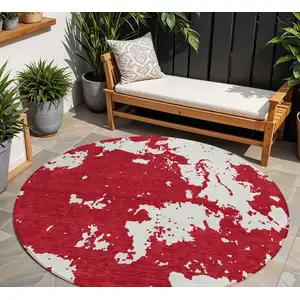 Photo of 8' Red And Ivory Round Abstract Washable Indoor Outdoor Area Rug