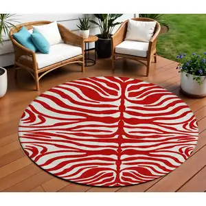 Photo of 8' Red And Ivory Round Animal Print Washable Indoor Outdoor Area Rug