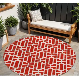 Photo of 8' Red And Ivory Round Geometric Washable Indoor Outdoor Area Rug