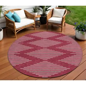 Photo of 8' Red And Ivory Round Geometric Washable Indoor Outdoor Area Rug