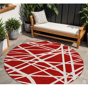 Photo of 8' Red And Ivory Round Geometric Washable Indoor Outdoor Area Rug