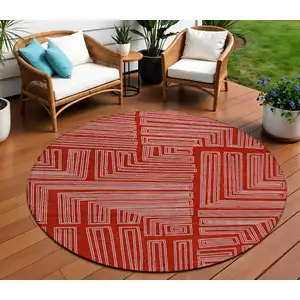 Photo of 8' Red And Ivory Round Geometric Washable Indoor Outdoor Area Rug