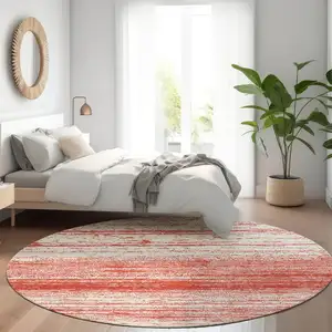 Photo of 8' Red And Ivory Striped Washable Round Rug With UV Protection