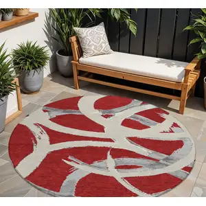 Photo of 8' Red Beige And Gray Round Abstract Washable Indoor Outdoor Area Rug
