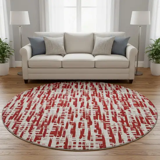 8' Red Beige And Ivory Abstract Geometric Washable Round Rug With UV Protection Photo 2