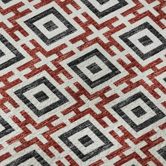 8' Red Black And Ivory Geometric Washable Round Rug With UV Protection Photo 9