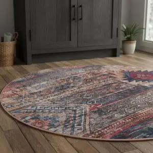 Photo of 5' Red Geometric Power Loom Worn Faded Round Rug