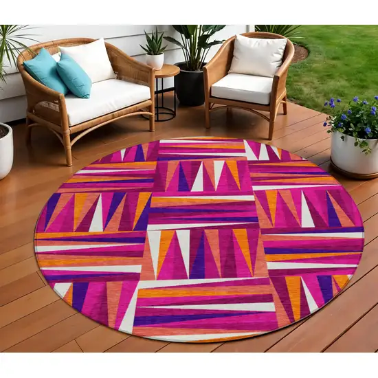 8' Red Purple And Copper Round Geometric Washable Indoor Outdoor Area Rug Photo 1