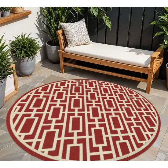 Red and Ivory Round Geometric Stain Resistant Indoor Outdoor Area Rug Photo 1
