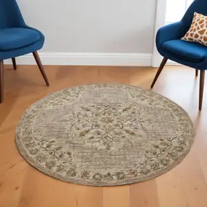 Photo of 6' Round Beige Distressed Medallion Area Rug