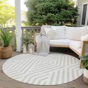 Photo of 8' Round Beige and Ivory Round Geometric Washable Non Skid Indoor Outdoor Area Rug