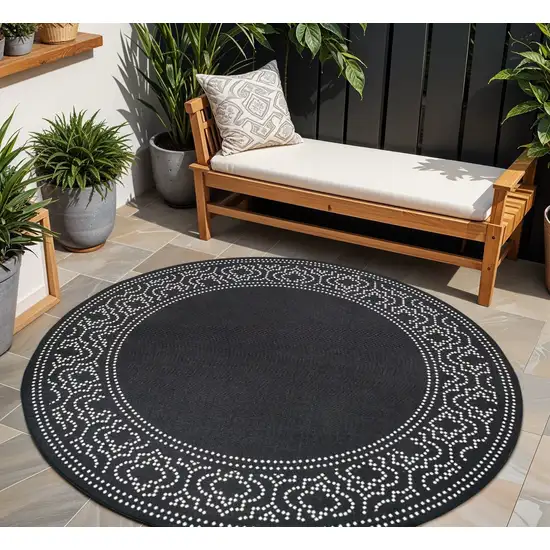 Black and Ivory Round Stain Resistant Indoor Outdoor Area Rug Photo 1