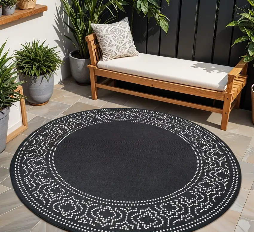 Black and Ivory Round Stain Resistant Indoor Outdoor Area Rug Photo 1