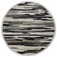 Photo of 4' Round Black and Gray Camouflage Area Rug
