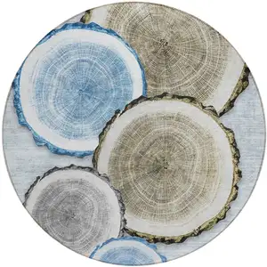 Photo of 8' Round Blue Gold and Gray Round Faux Bois Washable Non Skid Indoor Outdoor Area Rug