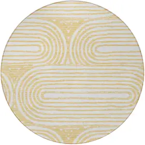 Photo of 8' Round Gold and White Round Abstract Washable Non Skid Indoor Outdoor Area Rug