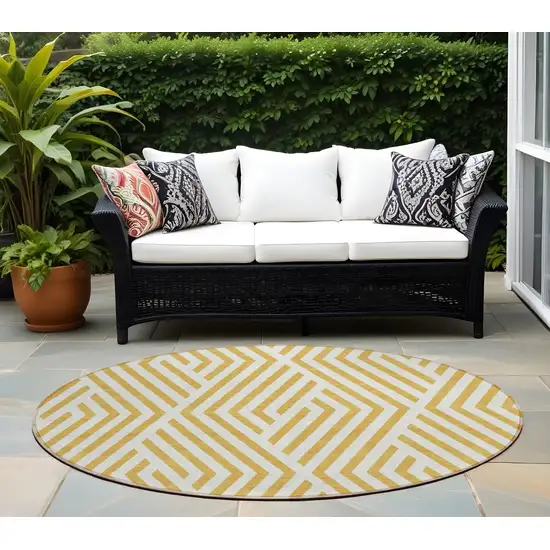 Gold and White Round Geometric Washable Non Skid Indoor Outdoor Area Rug Photo 1