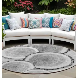 Photo of 8' Round Gray and Black Round Faux Bois Washable Non Skid Indoor Outdoor Area Rug