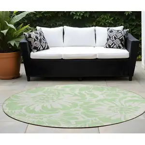 Photo of 8' Round Mint Green and Ivory Round Floral Washable Non Skid Indoor Outdoor Area Rug