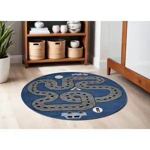 Photo of 5' Round Navy Imaginative Racetrack Area Rug