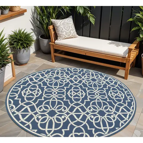 Blue and Ivory Round Geometric Stain Resistant Indoor Outdoor Area Rug Photo 1