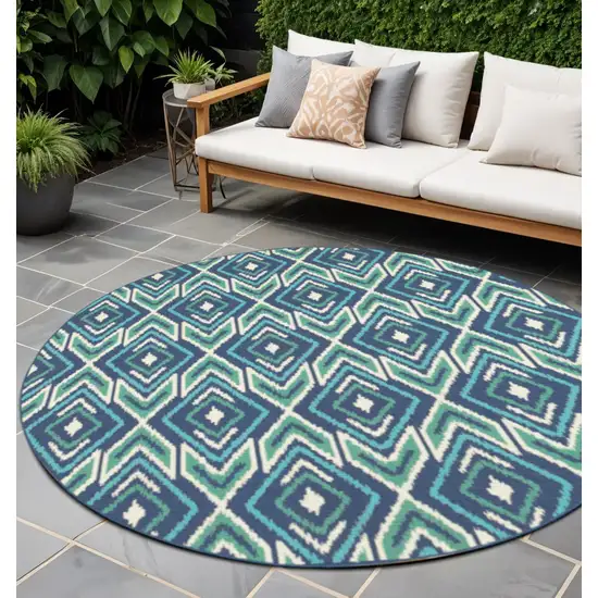 Blue and Ivory Round Geometric Stain Resistant Indoor Outdoor Area Rug Photo 1