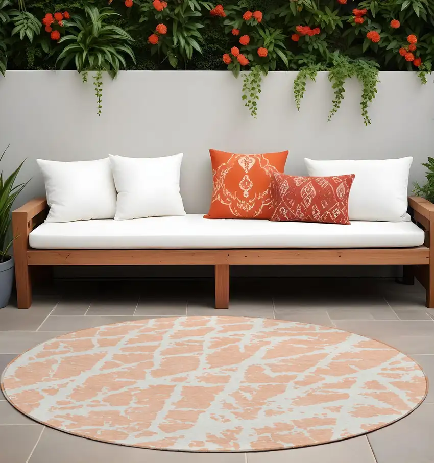 8' Round Peach and Ivory Round Abstract Washable Non Skid Indoor Outdoor Area Rug Photo 1