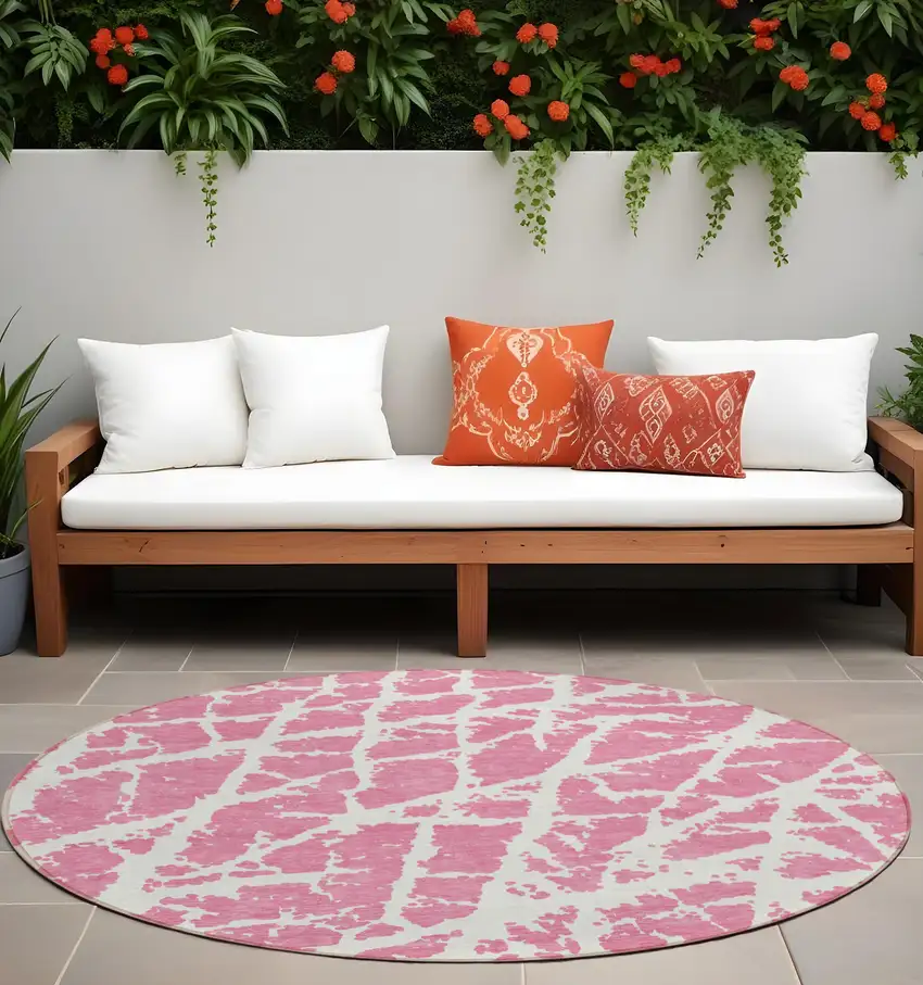 Pink and Ivory Round Abstract Washable Non Skid Indoor Outdoor Area Rug Photo 1
