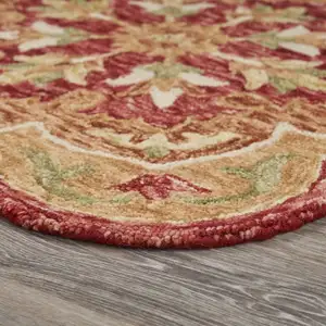 Photo of 4' Round Rustic Red Scalloped Edge Area Rug