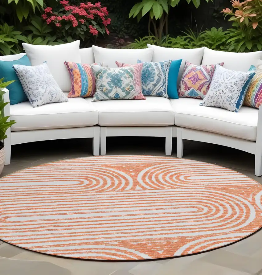 Orange and Ivory Round Abstract Washable Non Skid Indoor Outdoor Area Rug Photo 1