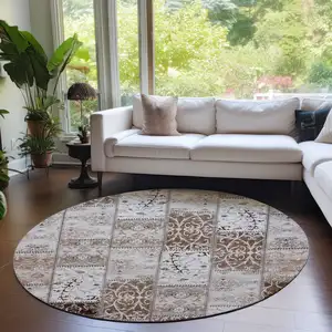 Photo of 8' Round Taupe and Ivory Round Patchwork Washable Non Skid Indoor Outdoor Area Rug