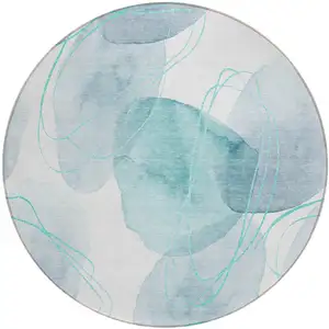 Photo of 8' Round Teal and Ivory Round Abstract Washable Non Skid Indoor Outdoor Area Rug