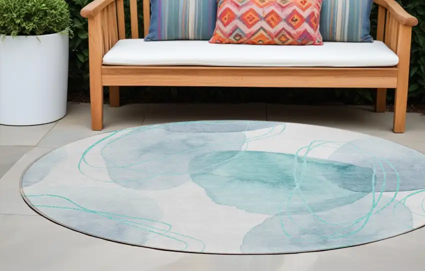 Teal and Ivory Round Abstract Washable Non Skid Indoor Outdoor Area Rug Photo 1