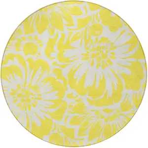 Photo of 8' Round Yellow and Ivory Round Floral Washable Non Skid Indoor Outdoor Area Rug