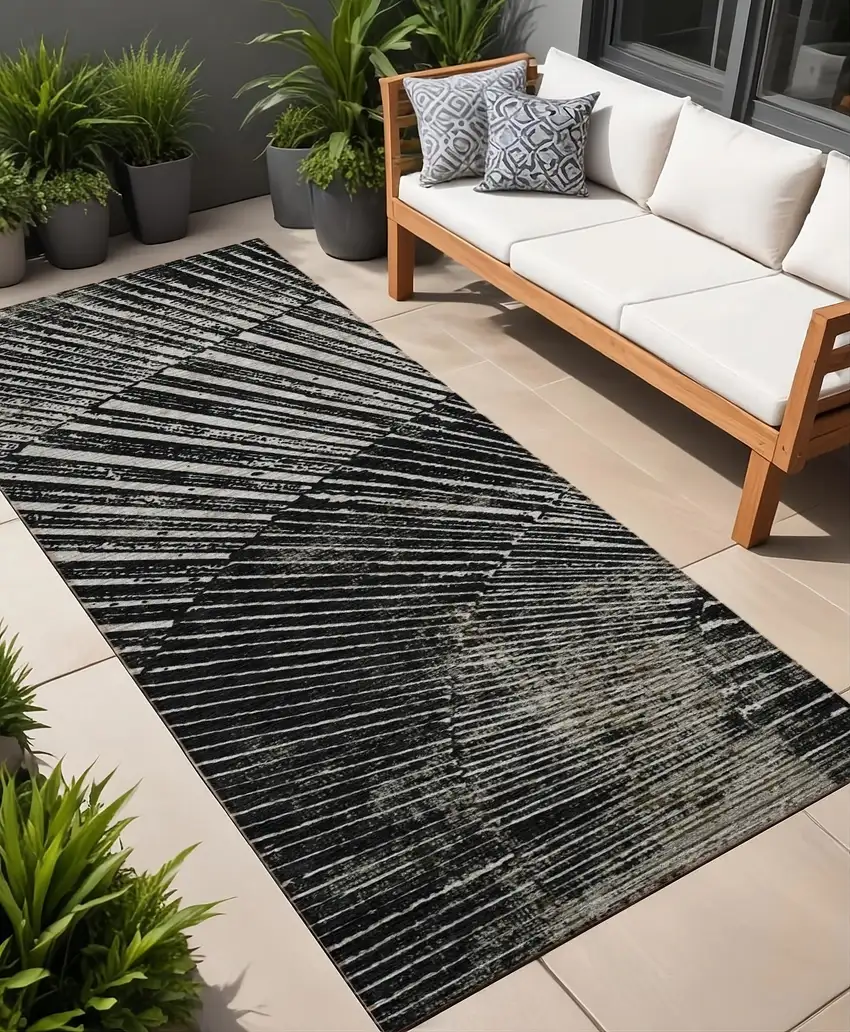 8' Runner Black and Ivory Abstract Washable Non Skid Indoor Outdoor Runner Rug Photo 1
